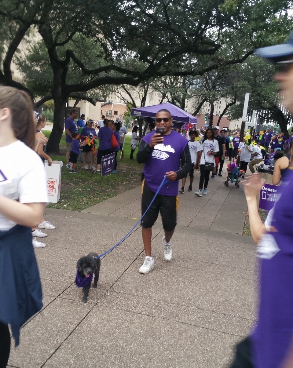 Participant walking with a dog at the Alzheimer’s Walk