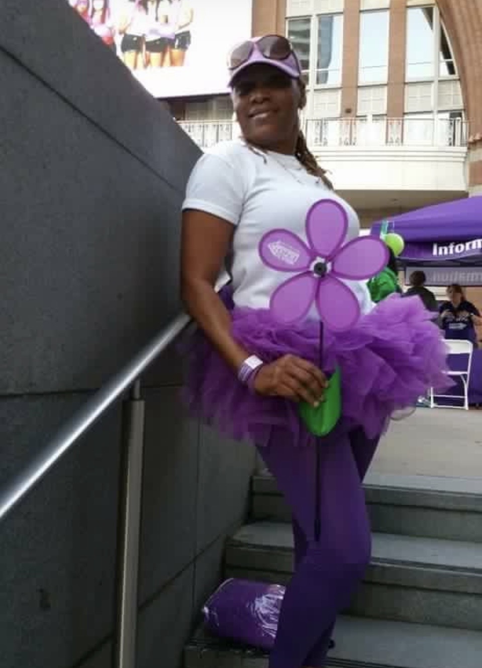 Diane dressed in purple at a community awareness walk