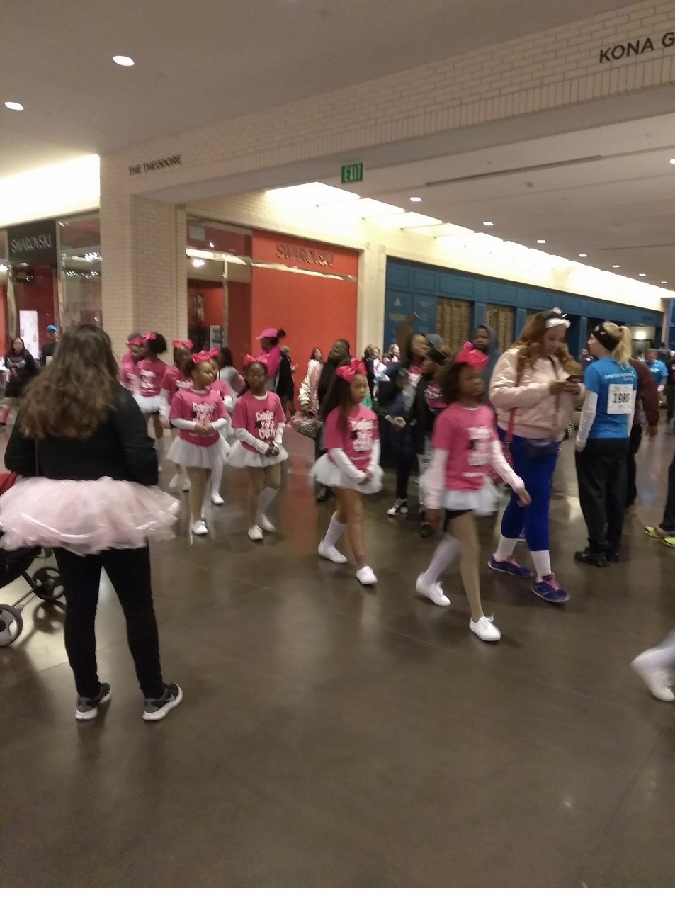 Participants gathering indoors for the Breast Cancer Walk